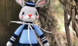 Knitted woolen grey rabbit doll